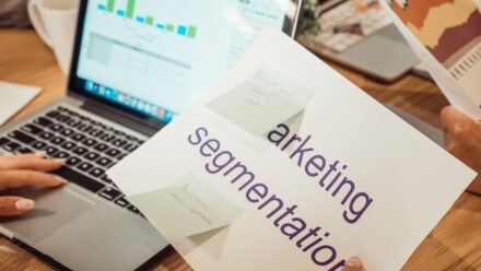 person holding a white paper document